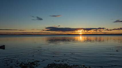 Midnight sun over the Porttipahta reservoir lake in Lapland, Finland