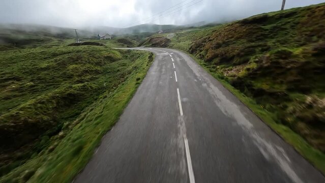 FPV aerial drone video of col de aubisque summit and twisty road in France