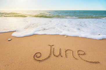 June word on sea shore at day