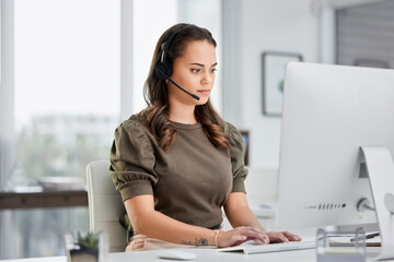 Virtual assistant, computer or woman typing in call center consulting online at customer services help desk. Research, crm agent or girl consultant in telemarketing or telecom sales company in office