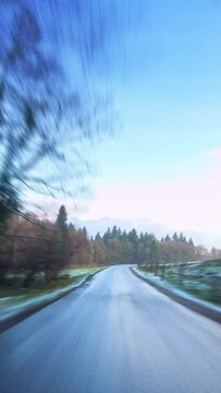 Idyllic countryside, winter season, car driving point of view, hyperlapse, vertical phone background