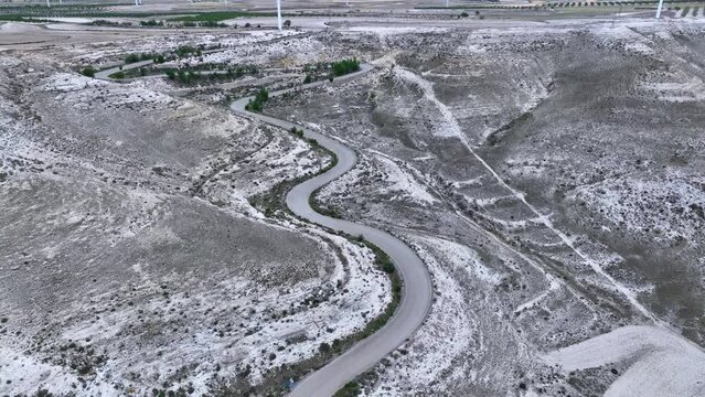 Aerial view of the landscape of crops and wind farms in the Curvas del Caracol. The Tooth. Saragossa. Aragon. Spain. Europe
