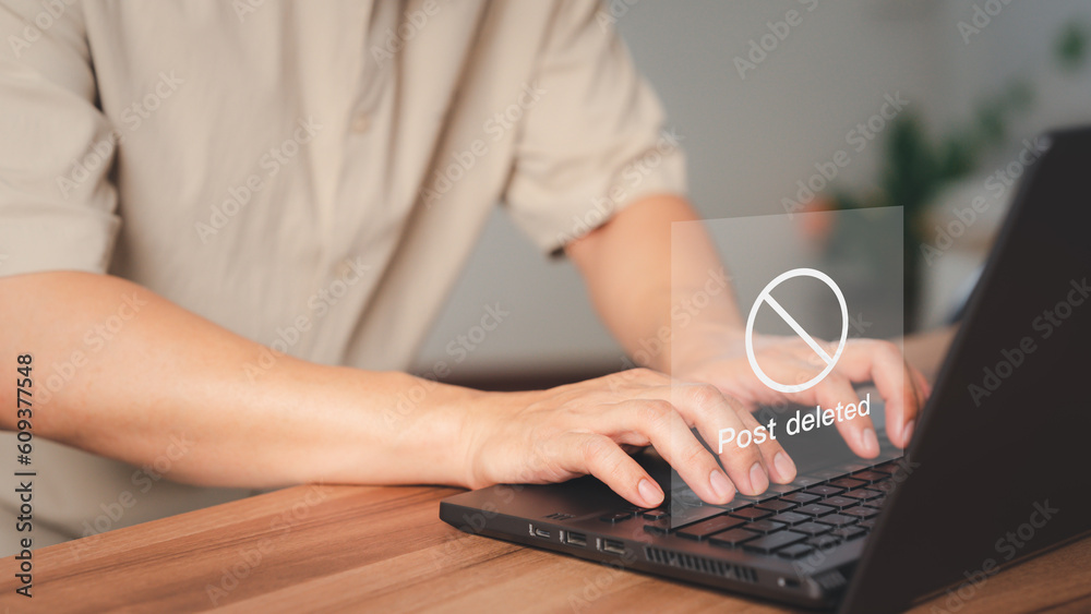 Poster young man using a laptop to play social media, but the post has been deleted. searching for more int