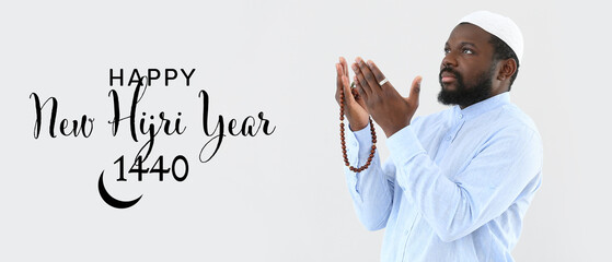 Banner for Islamic New Year with praying African-American Muslim man