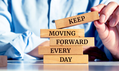 Close up on businessman holding a wooden block with a 