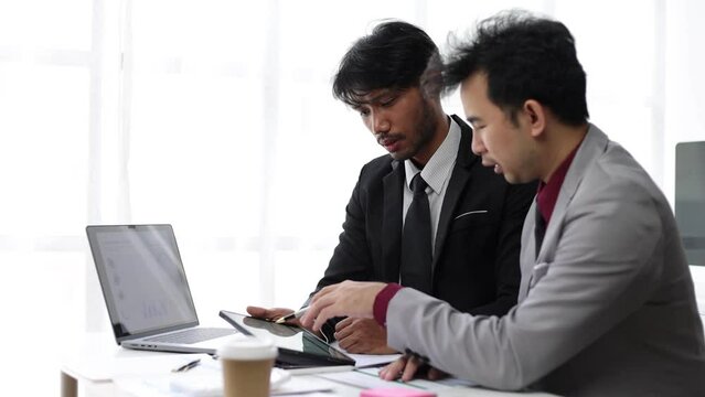 Financial adviser businessman discussing growing business chart for investment analysis and financial planning.