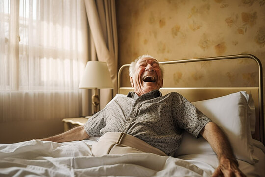 Happy old man in the bed of a nursing home