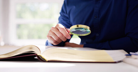 Lawyer Law Book With Magnifying Glass