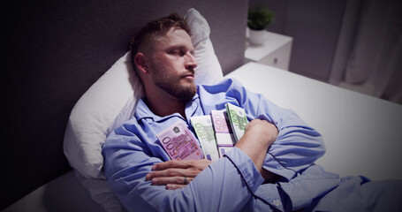 Man Sleeping On Bed With Bundle