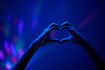 Lights, heart hands of fan at party or concert at night, stadium lighting and bokeh with mock up....