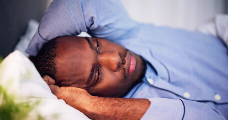 Young African Man Suffering From Fever Lying