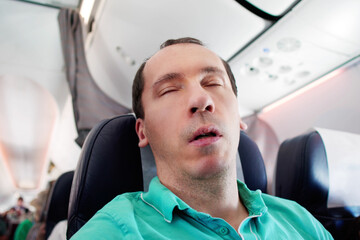 Man Snoring While Sleeping On Plane