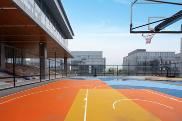 Basketball court and office building in the technology park © onlyyouqj