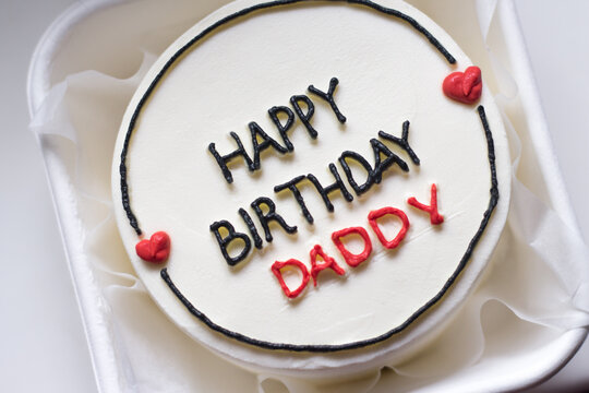 Happy birthday cake. Happy birthday cake background. Happy birthday cake on a white background. Birthday cake for dad with the words "Happy birthday daddy". White birthday cake.