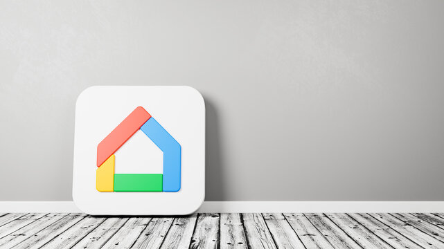 Google Home App Icon on Wooden Floor Against Wall