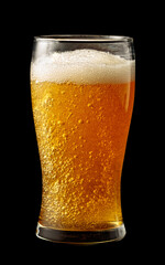 Glass of beer isolated on a black background.