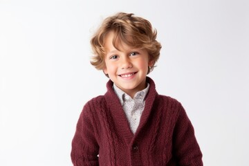 Portrait of a cute little boy in a warm sweater on a white background