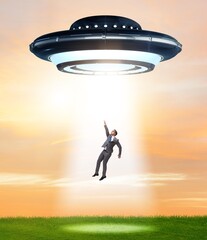 Flying saucer abducting young businessman