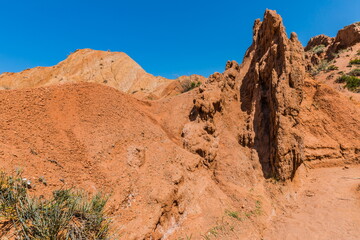 Fototapeta premium Skazka (Fairytale) Canyon - the most unusual and picturesque gorge on the southern shore of Issyk-Kul, the main attraction in the vicinity of the lake, Kyrgyzstan