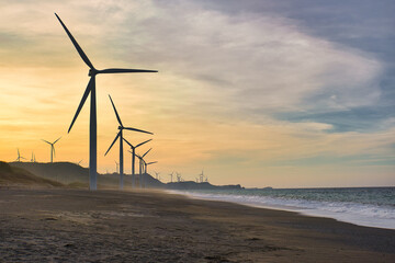 wind turbines with the sunset