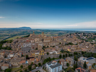 Fototapeta premium Italy, June 02, 2023: aerial view of the beautiful medieval village of Potenza Picena. The village is located on the Marche hills in the province of Macerata