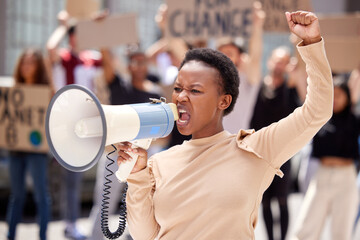 Equality, protest and black woman leader with megaphone and shouting loud for justice due to...