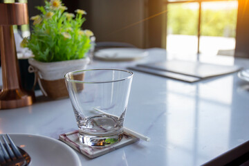 Empty glasses of water on the table prepared for serving.