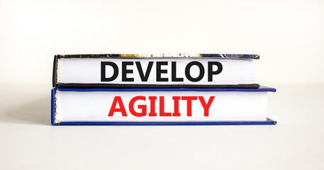 Develop agility symbol. Concept words Develop agility on beautiful books on a beautiful white table white background. Business, support and develop agility concept. Copy space.