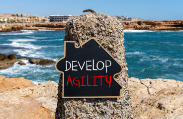 Develop agility symbol. Concept words Develop agility on beautiful black chalk blackboard on a...