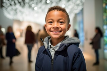 Medium shot portrait photography of a grinning child male that is wearing a chic cardigan against a modern art exhibit with visitors and installations background . Generative AI