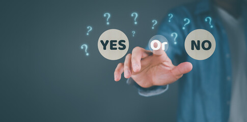 Deciding. Choose a business path, think with a yes or no option. Leadership in Difficult Situations..yes or no and question mark Two sticks with the word yes or no