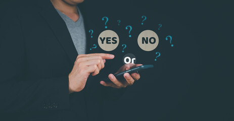 Deciding. Choose a business path, think with a yes or no option. Leadership in Difficult Situations..yes or no and question mark Two sticks with the word yes or no