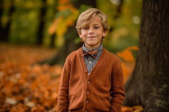 Medium shot portrait photography of a pleased child male that is wearing a chic cardigan against a brilliant display of fall foliage in a forest background . Generative AI