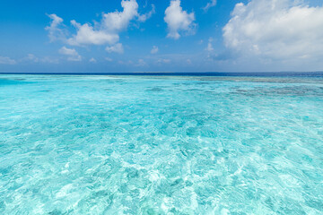 Sunny blue sea and sky. Clear calm ocean bay, peaceful waves. Earth environment day concept....
