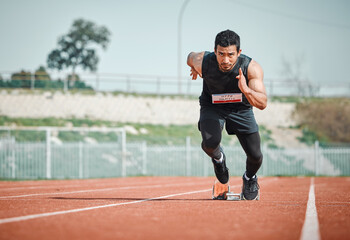 Stadium focus, man running and athlete on a runner and arena track for sprint race training. Fast, run and sports exercise of a male person in marathon for fitness and cardio workout outdoor