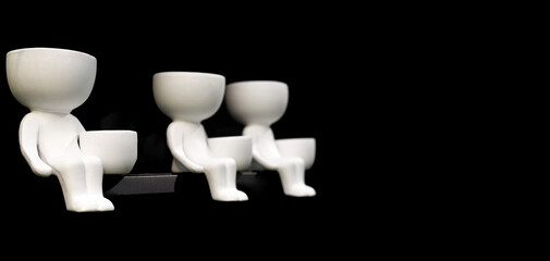 White flowerpots in the form of men