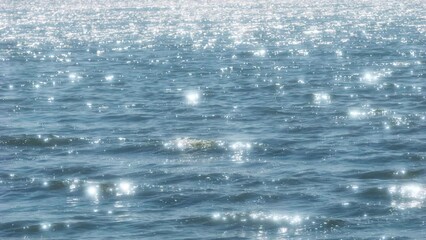 Fresh landscape of twinkling waves by sunlight at blue sea or ocean near a beach in summer, Nobody, Travel or vacation background, Slow motion	 - Powered by Adobe