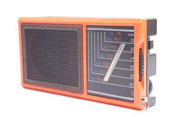 Old transistor radio isolated on white.
