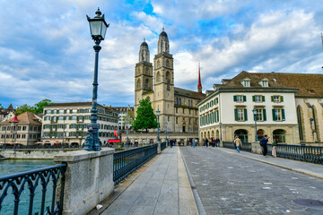 Fototapeta na wymiar Scenic evenning view of historic Zurich city center with Grossmunster Church and river limmat , Switzerland