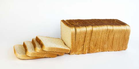 Sliced white toasted bread on a white background. Concept of making breakfast.
