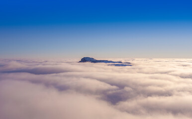 clouds and mountain top in Ceahlau, Romania Carpathians