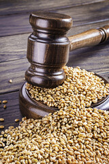 Gavel and scattered wheat grains
