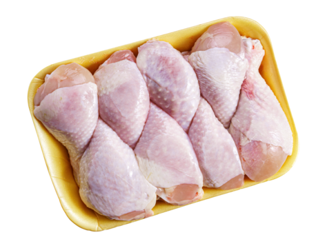 Raw chicken drumsticks in a tray isolated