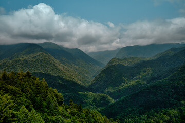 Obraz premium Mountain ranges on a sunny day at Georgia. Sky with clouds adn hills