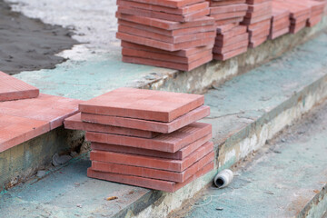 Fototapeta na wymiar Installation of tiles for pedestrian paths. improvement of the city.