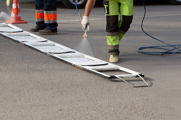 Installation of markings on the road. Repair of the road for cars in the city.