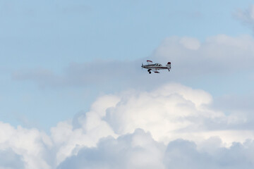 Small plane. A single engine plane crosses the blue sky. Transportation.