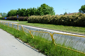 Broken barrier by the road as a result of a car collision of a minor accident
