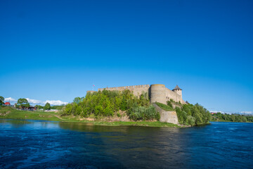 Ivangorod Fortress on the banks of the Narva River on a sunny May day