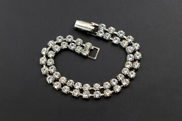 Dainty clear crystal bracelet, unique vintage jewelry background, rhinestone jewelry concept, promotional photo for an online jewellery store